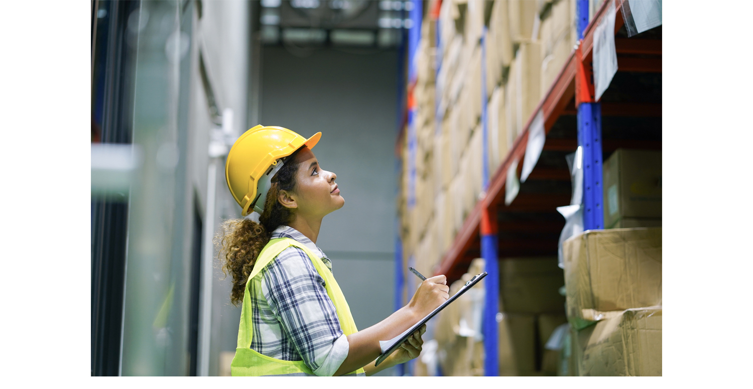 Female worker takes inventory in a warehouse